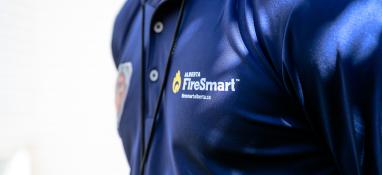 Photo of a FireSmart employee's shirt logo