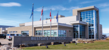 Grey building with windows with Canada and Alberta flags