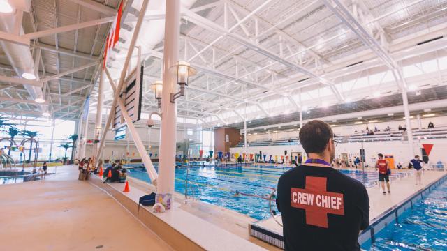 Crew Chief Lifeguard Looking Over Pool